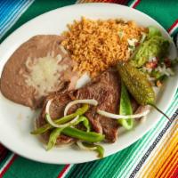 Carne Asada Plate  · Two piece of Steak with sautéed bell pepper, onion, grilled jalapeño, and guacamole.