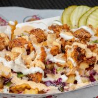 Baba'S Loaded Fries · Crinkle cut fries topped with coleslaw, a chopped tender, cheese sauce, ranch, and our signa...