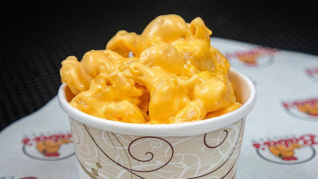 Cheddar Mac & Cheese · Our creamy cheddar mac and cheese is made in house daily with real cheese and our own signature recipe.