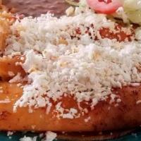 Enchiladas  / Enchiladas De  (3) · With cheese or chicken.
con arroz y frijol