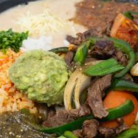 Fajitas Plate · Cook with pasilla chile, onions & tomatoes grill chicken or steak. Comes with rice and beans...