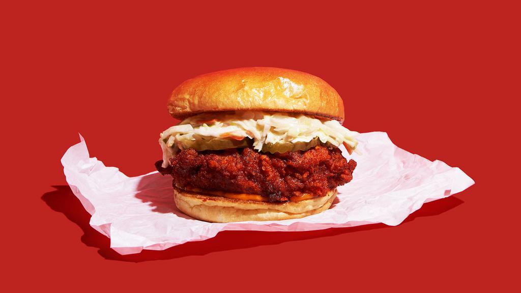 Nashville Hot Chicken Sandwich · Nashville-style spicy hot, crispy fried chicken breast with coleslaw, pickles, and nashville sauce on a brioche bun.