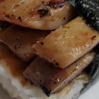 Grill Chicken Musubi · sliced of grilled chicken on top of a block of rice , wrapped together with nori and house s...