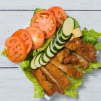 Chicken Katsu Salad · Green salad with sliced tomatoes, cucumber and crouton topped with chopped chicken katsu.