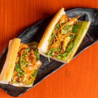 Banh Mi (Eggs) · Fresh baked baguette with house spread, cucumber, jalapeño, pickled carrot, cilantro, green ...