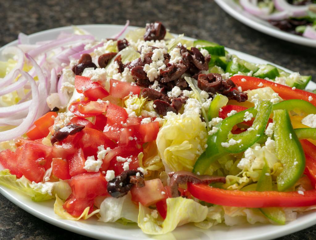 Greek Salad · Romaine lettuce, feta cheese, tomatoes, onions, bell peppers, cucumbers & kalamata olives.