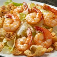 Shrimp Caesar Salad · Garlic marinated shrimp on crisp romaine lettuce with croutons and parmesan cheese tossed wi...