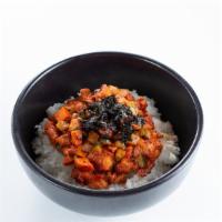 Chicken Bulgogi Bibimbap · Spicy or mild. Topped with sesame seeds, seaweed, nuts and served on a bed of rice.