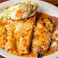 #28 Tropical Mexico Combination · Chile relleno, shredded beef taco, cheese enchilada, and tamal.