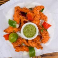 Chicken Pakora · Cubes of boneless chicken marinated and dipped in chickpea batter and deep fried.