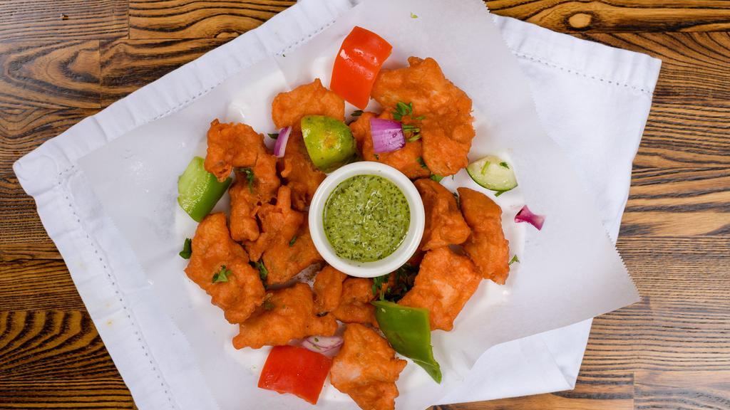 Fish Pakora · Six pieces. Fish, boneless, and skinless, marinated with lemon juice, spices, deep fried.