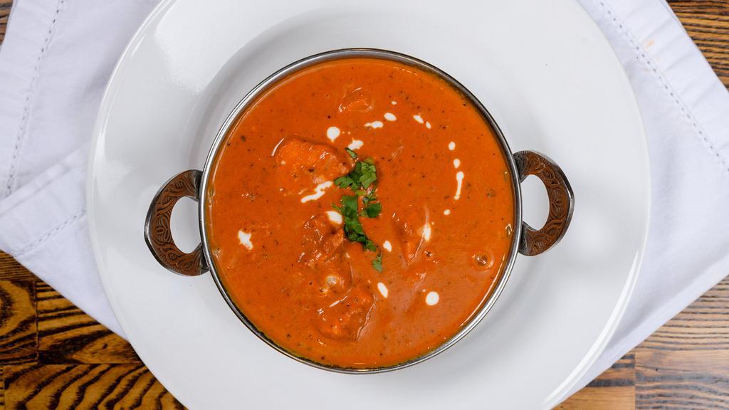 Chicken Tikka Masala · Boneless tandoori chicken cooked in house special masala with sliced onions, tomatoes, ginger and bell peppers.