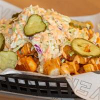 Spicy Chicken Fries · Sweet Heat Chicken Tenders, Seasoned Crinkle Fries, Tangy Slaw, Spicy Mayo Sauce, & Pickles.