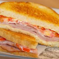 Ham & Cheese Melt · Grilled Ham, Served on Sourdough bread, Pepper Jack, Tomatoes, & Mayo.