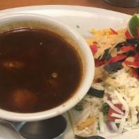 The One & Only Tortilla Soup · Two cheeses, tomato, corn, avocado, red onions, cilantro, scallions, spiced chicken broth, t...