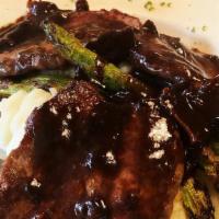 Steak Dianne · Grilled fillet mignon medallions with red wine mushrooms and balsamic sauce served with mash...
