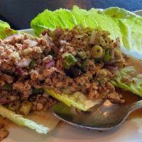 Chicken Larb · Minced chicken cooked in Thai style with romaine lettuce.