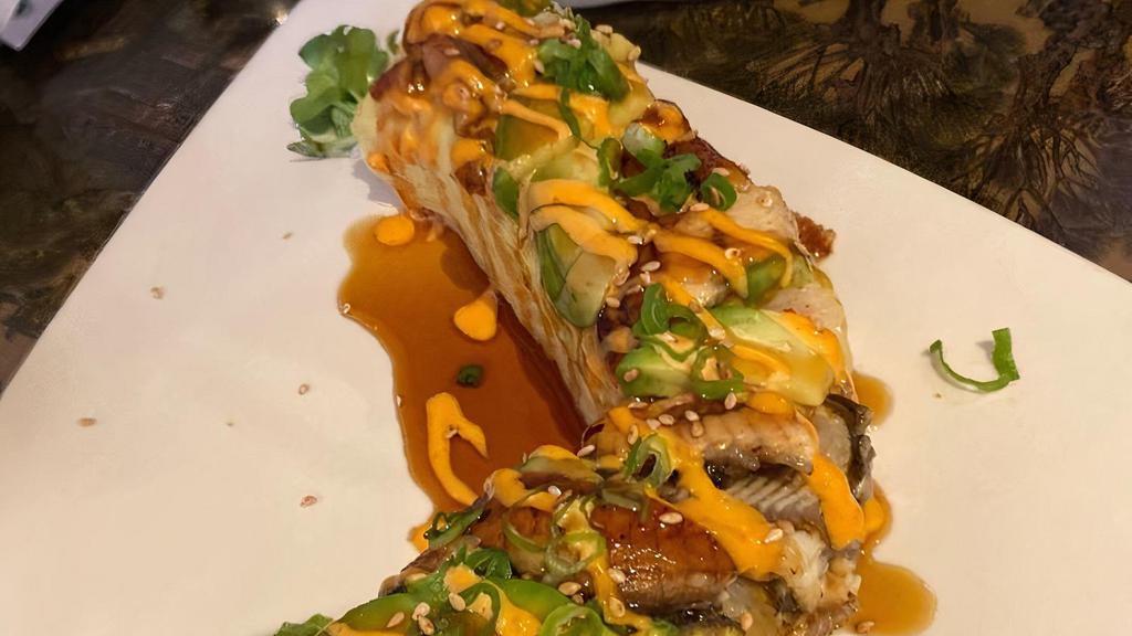 Miyagi Roll · Soft shell crab, snow crab, avocado, sprouts. Topped with unagi, avocado, unagi sauce, spicy mayo and green onions wrapped in soy paper..