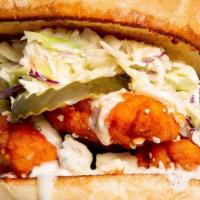 Buffalo Chicken Sandwich · Tender chicken tossed in a mild buffalo sauce and blue cheese crumbles topped with coleslaw ...