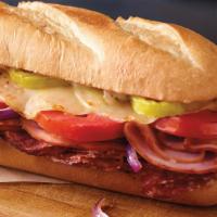 Italiano Sub · Ham, salami, provolone cheese, banana peppers, tomatoes, red onions and sub dressing.