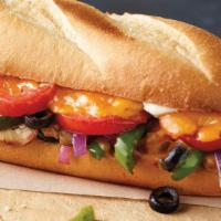 Veggie · Mushrooms, green peppers, onions, black olives, tomatoes, cheddar cheese and sub dressing.