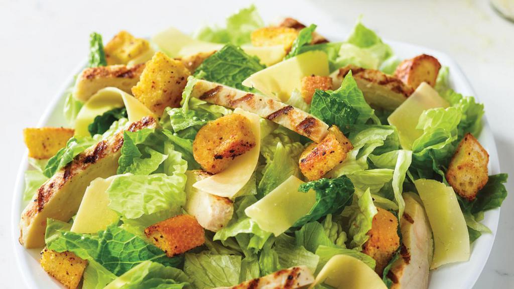 Chicken Caesar · Fresh-cut lettuce blend, grilled chicken, Parmesan cheese, and croutons made daily; served with caesar dressing. Regular: 300 cal.; 150 cal. per serving, family: 530 cal.; 130 cal. per serving.