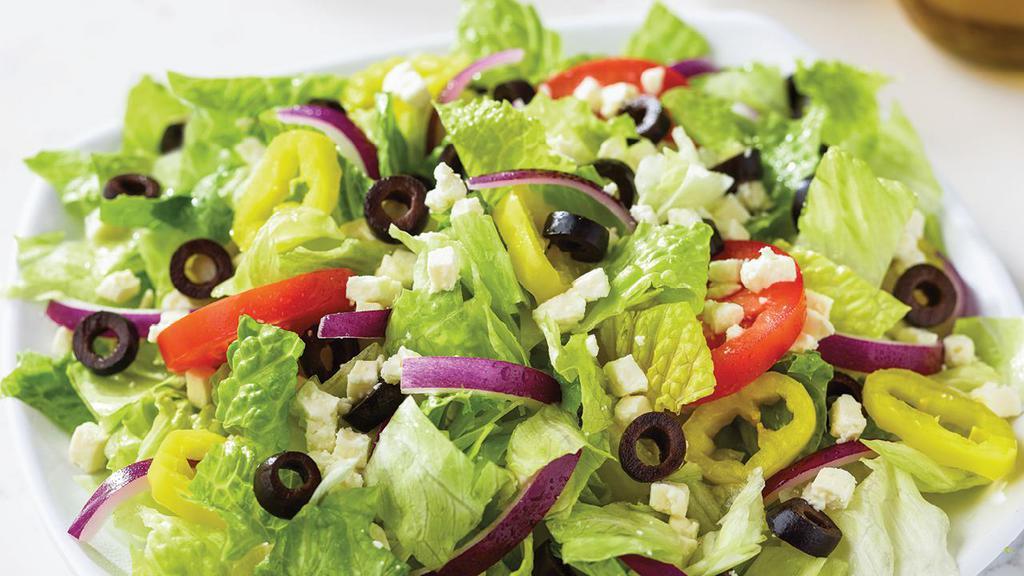 Family Greek Salad · Fresh-cut lettuce blend, feta cheese crumbles, black olives, sliced tomatoes, onions and banana peppers. 110  cal per serving.