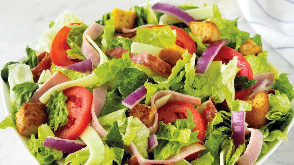 Italian Chef Salad · Fresh-cut lettuce blend, ham, salami, provolone cheese, sliced tomatoes, red onions and croutons made daily; served with Italian dressing