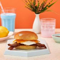Loaded Bacon Breakfast Sandwich · Two fried eggs, bacon, tomato, and cheddar cheese on your choice of bread.