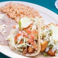 (2) Fish Tacos · 2 Breaded Deep Fried Fish on 2 Soft Corn Tortillas with Cabbage, Tartar Sauce, & Mexican Sal...