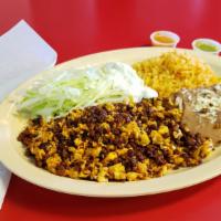 Chorizo Plate · Chorizo, Eggs, Lettuce, Cheese, Sour Cream, Rice & Beans on the Side. With Choice of Corn/ F...