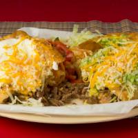 Chimichanga · Shredded Beef or Shredded Chicken with Beans & Cheese, inside Deep Fried Burrito. Topped wit...
