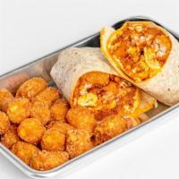 La Breakfast Burrito · Scrambled eggs. bacon, breakfast sausage. tater tots and cheddar cheese wrapped in a flour t...
