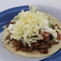 Super Taco · Soft Tortilla, choice of meat, guacamole, sour cream, cheese, pico de gallo.