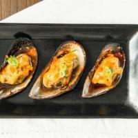 Baked Mussels (3 Pcs) · Green mussels baked with dynamite sauce top with massago and green onions.