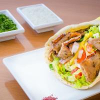 Gyro Jumbo Wrap · Slices of seasoned lamb & beef slow grilled, served in pita bread with lettuce, tomato, medi...