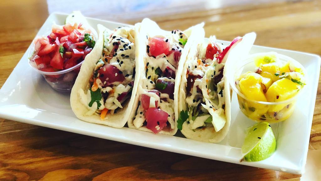 Killer Tacos (3) · Flour tortilla filled with shredded cabbage, raw ahi tuna, aioli sauce, killer a sauce and topped with sesame seeds. Choice of mango salsa or pico de gallo.
