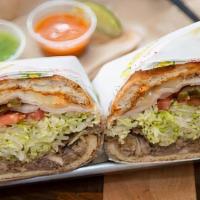 Cubana Torta · Pork, ham, breaded steak and turkey with beans, jalapeno, onion, tomato, lettuce, cheese, av...