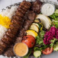 Soltani Kabob · A skewer of large chunks of marinated first choice fillet mignon and a skewer of chuck roll ...