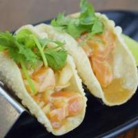 Salmon Poke (2) · Jinya's origins salmon poka in a crispy wonton taco shell, cilantro.