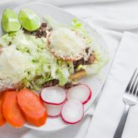 Sopes · Your choice of meat, beans, lettuce, tomatos, sour cream, and cheese.