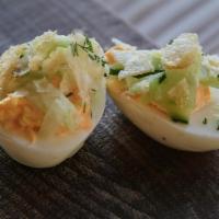 Deviled Eggs · mayo sriracha, pickled cucumbers, dill, chips