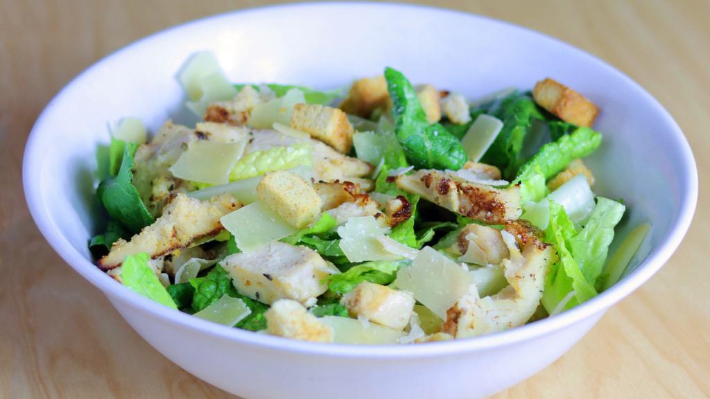 Chicken Caeser Salad · 2 Servings. Chicken, Romaine, Shaved Parmesan & Croutons