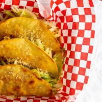 Tres Krispy Tacos (3 Count) · KING SIZE Corn Tortilla, choice of meat, cheddar cheese, lettuce, parmesan cheese.