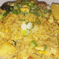 Pineapple Fried Rice · Yellow curry powder, pineapple, cashew nuts, raisins, egg, green onions.