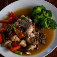 Beef With Oyster Sauce · Stir fried with black mushrooms and served with steamed broccoli and garnished with fresh gr...