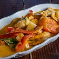Pineapple Curry · Spicy. Red curry with chicken, prawn, pineapple, tomato, and coconut milk.