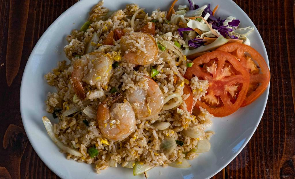 Thai Fried Rice · Fried rice with eggs, tomatoes, onions with a choice of pork, chicken, beef, or vegetarian.