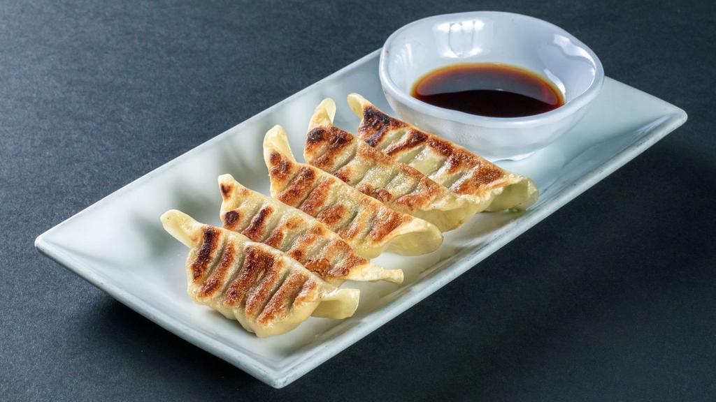 Pan-Fried Gyoza · Chicken and vegetable potstickers served with gyoza sauce.