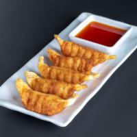 Deep Fried Gyoza · Chicken and vegetable potstickers served with gyoza sauce.